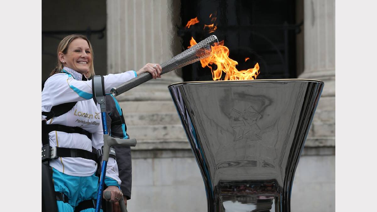 Disabled marathon runner Claire Lomas lights the Olympic cauldron for the Paralympic Games in Trafalgar Square. Photo: Peter Macdiarmid/Getty Images