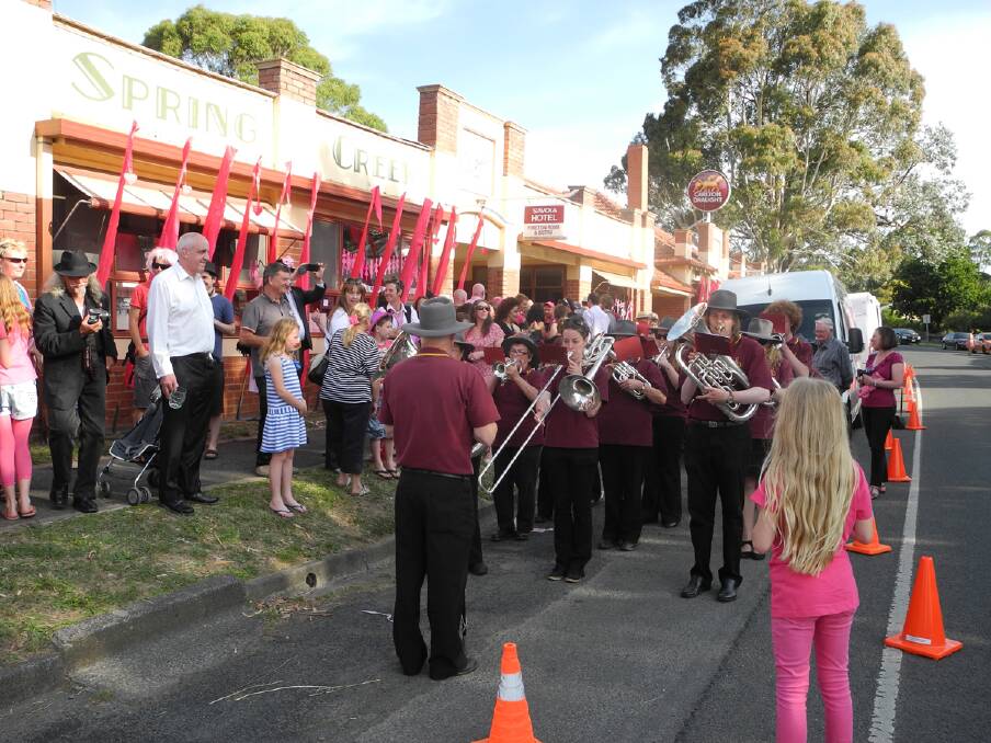 Daylesford Brass band welcoming Sam Johnson  into Daylesford and Hepburn Springs on his unicycle for Love Your Sister