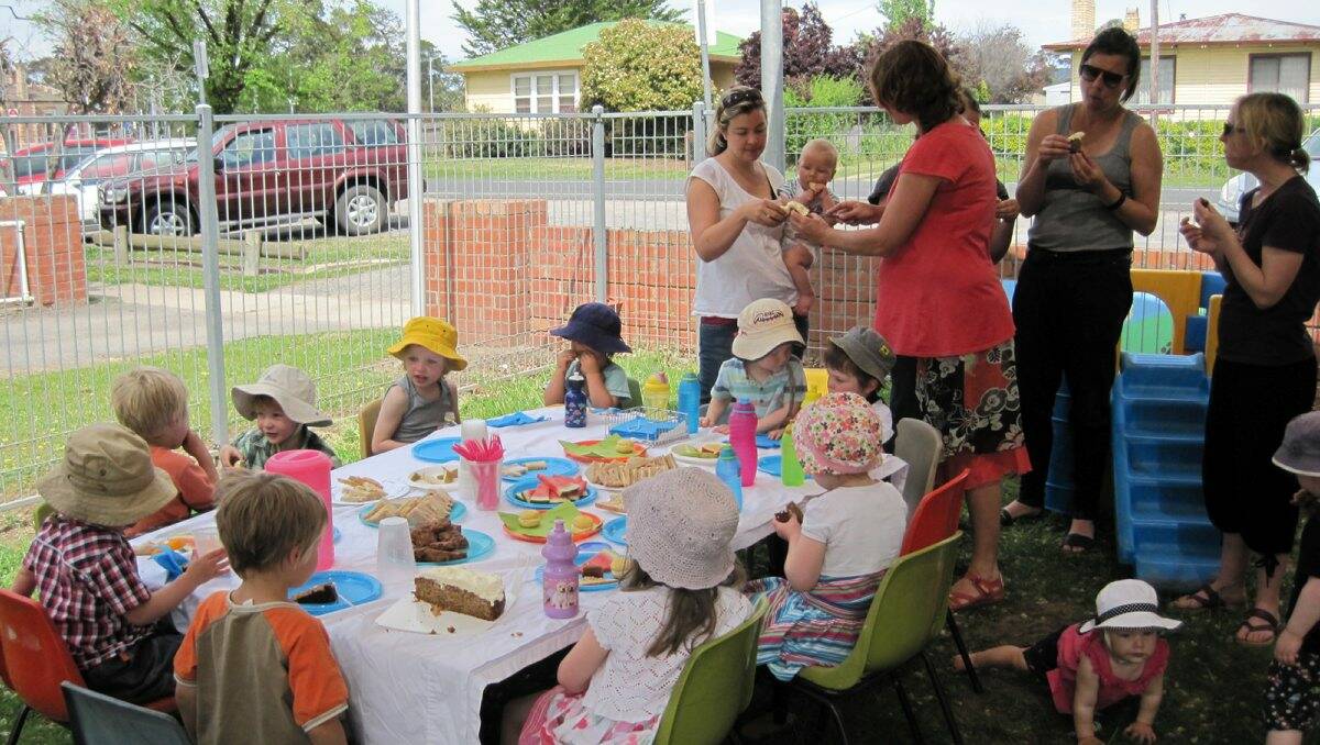 NEW ADDITION: Playgroup members celebrate their new cubby house with a cuppa. Picture: CONTRIBUTED