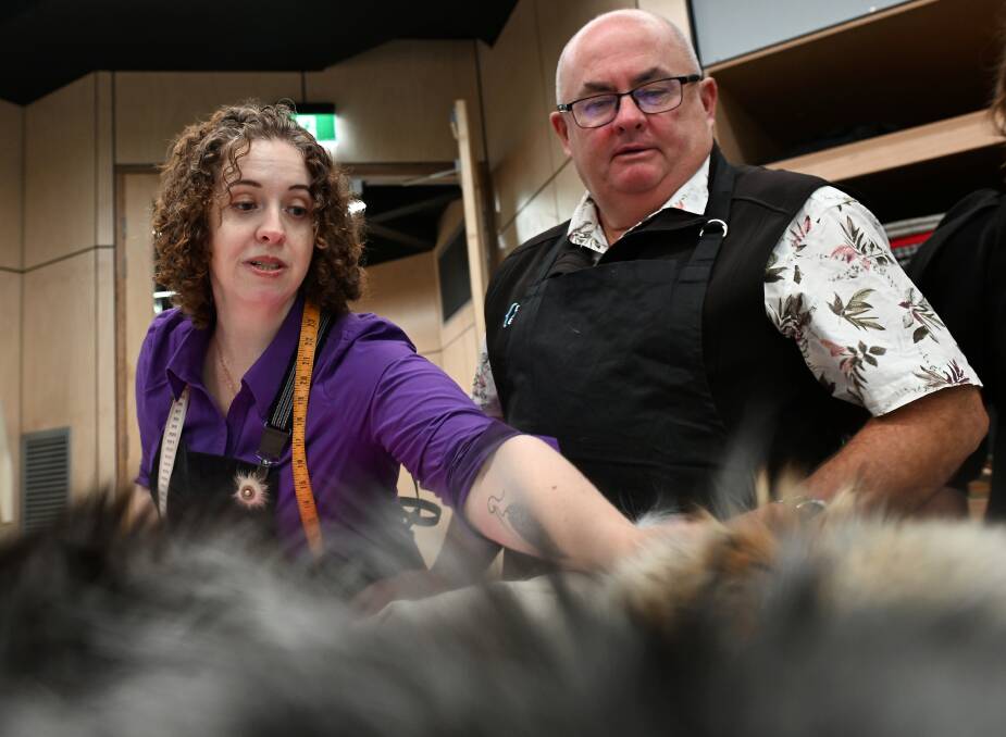 Ms Bailey showing Ballarat mayor Des Hudson some pelts. Picture by Lachlan Bence