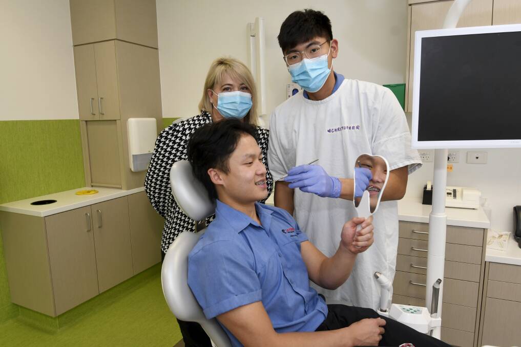 CHECK-UP: Ballarat Health dental operations director Jacqui Nolan with La Trobe University students Christopher Lee and John Do. Picture: Lachlan Bence