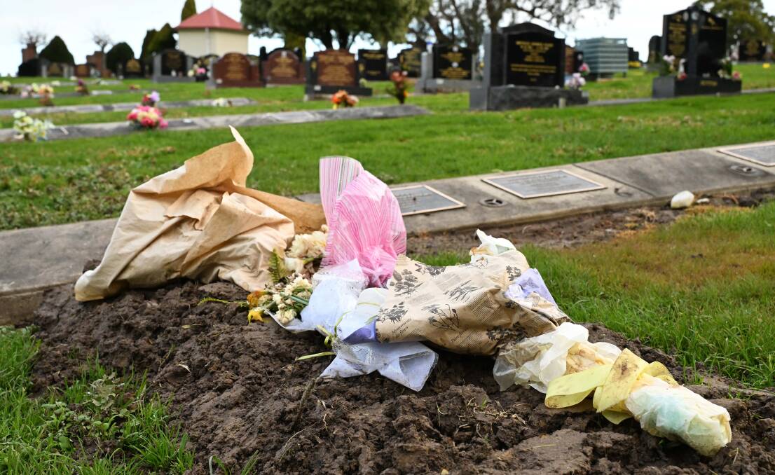 Flowers laid on the graves of Gail and Don Patterson who died of suspected mushroom poisoning. Picture by James Ross/AAP PHOTOS