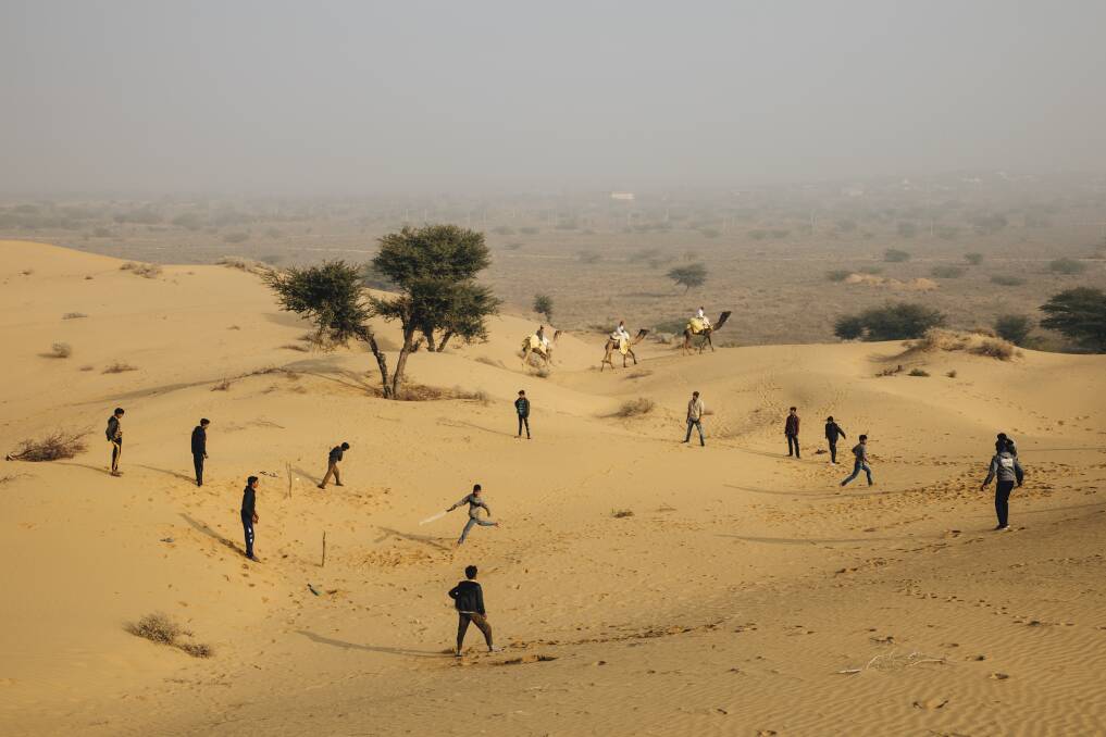 HOT BATTLE: Kids braving 50-degree temperatures to play cricket in the Thar Desert in Rajasthan.