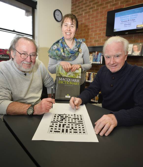 Smart moves: Keith Goodwin, Elizabeth Wells and Mike Gretton were part of the team of 20 Trentham residents that won the annual Snodgers crossword challenge for the Words in Winter festival. Photo: Dylan Burns