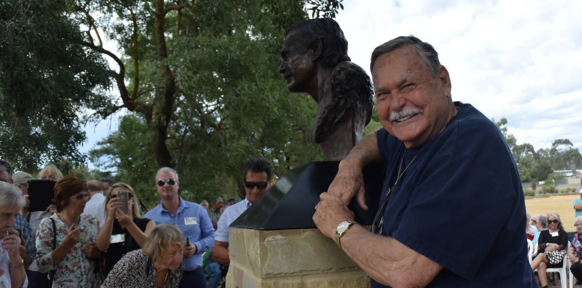 AFL legend: Ron Barassi poses beside his new bronze bust at the John Powell Reserve in front of scores of fans. Picture: Amber Wilson