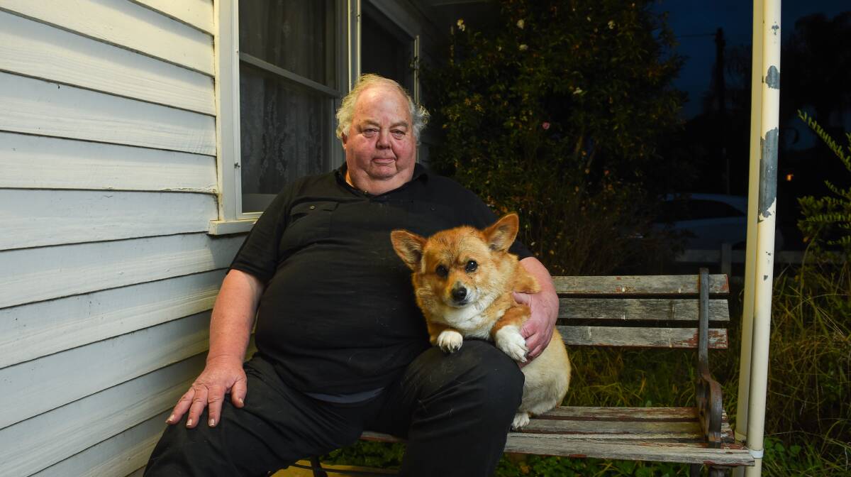 Unsuccessful legal action: Jeffrey Sill and his corgi pictured at their Wodonga home last year before his Supreme Court appeal.