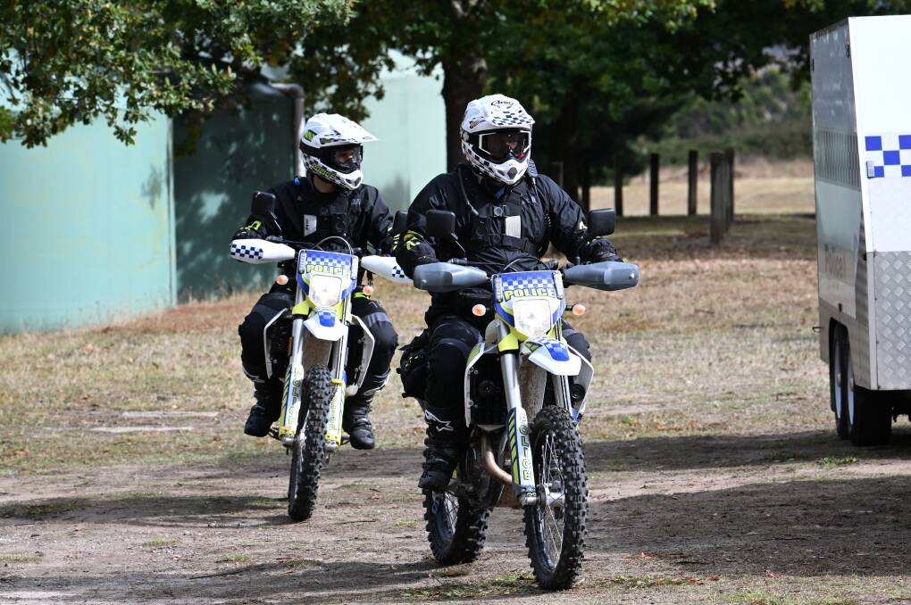 Police on dirt bikes leave the Napoleons Recreation Reserve to search for Samantha Murphy in the Enfield State Forest. Picture by Lachlan Bence