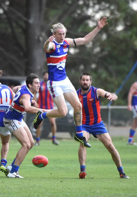 HIGH-FLYER: Daylesford's Zac Tisdale takes a giant leap during the weekend match between Daylesford and Hepburn. Picture: Lachlan Bence