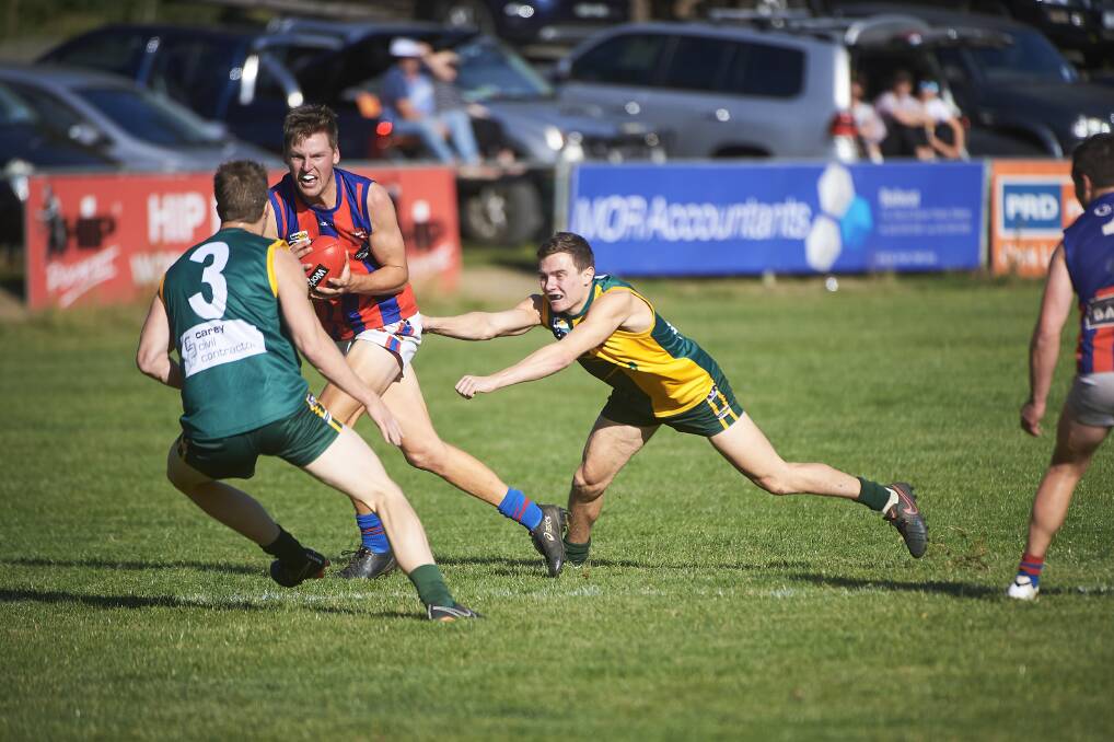 UNDER ATTACK: Hepburn's Zachary Hansford tries to break through a wall of Gordon players during the weekend's CHFL match. Picture: Luka Kauzlaric