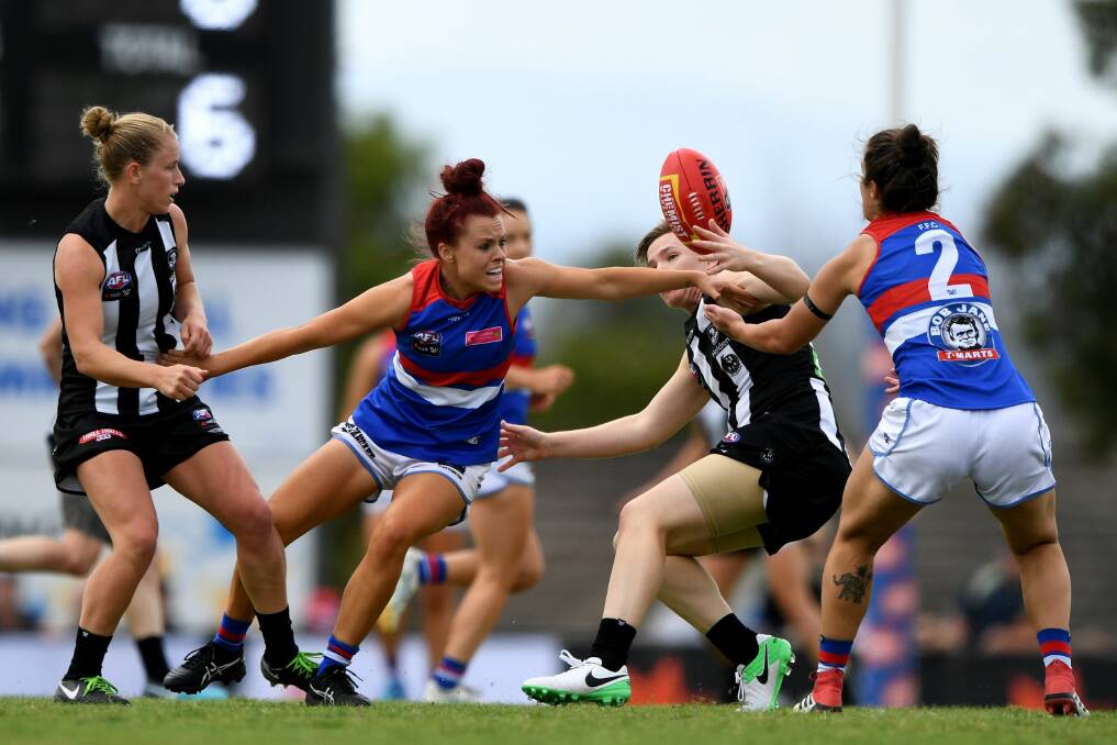 IN THE ACTION: Trentham's Jenna Bruton of the Bulldogs is tackled by Jaimee Lambert of the Magpies during the Round 5 AFLW match in Moe.