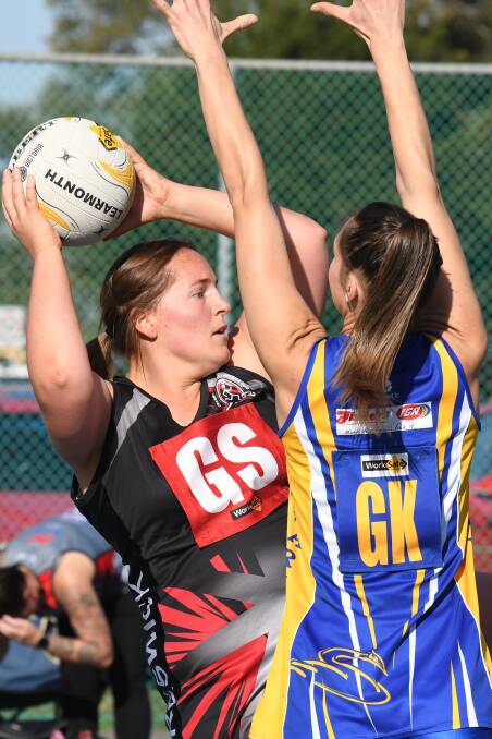 ON THE BALL: Shannon Palmer (Creswick) and Nicole O'Brien (Learmonth) during the weekend's CHFL netball match. Picture: Kate Healy