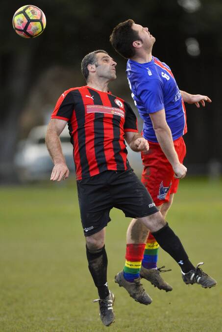 ON THE BALL: Mark Costanzo of the Vultures and Dragi Koleski of Daylesford compete for the ball during the BDSA Division 1 "pride" match. Story page 19