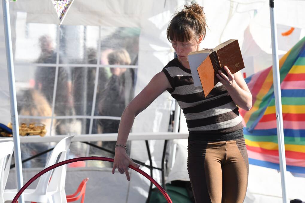 Showing off: Christy Flaws entertains the crowds on Fraser Street at the 12th annual Clunes Booktown Festival, which attracted more than 18,000 at the weekend. Pictures: Kate Healy 