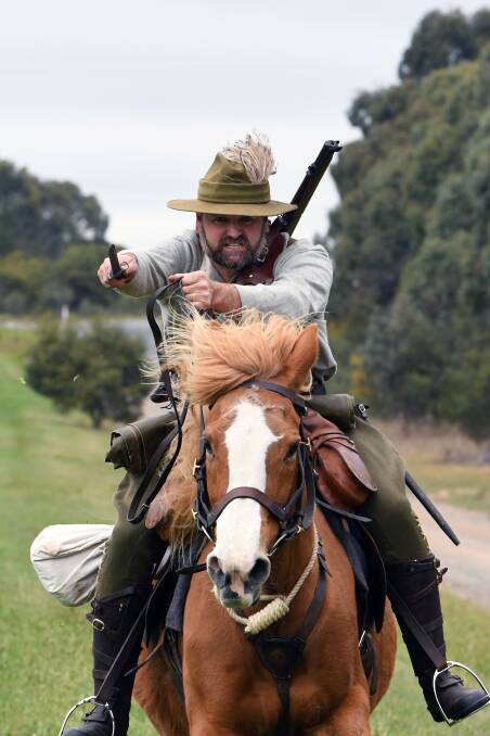 At the charge: Wayne Rigg of the Creswick Light horse Troop demonstrates the charge. Picture: Kate Healy.