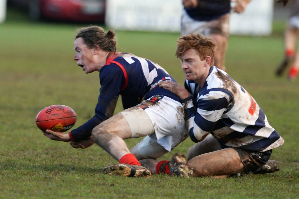 CONTESTED: Bungaree's Harry Russell tries to get free of Newlyn opponent Dylan McLachlan on Saturday afternoon. Russell and his Demons recorded a big win over the Cats. Picture: Kate Healy.