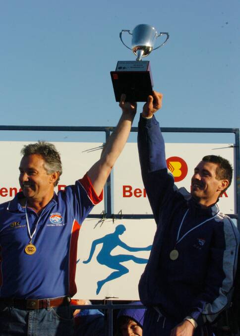 Coach Phil Davis and captain Rob Rodgers lift the CHFL cup in 2007.