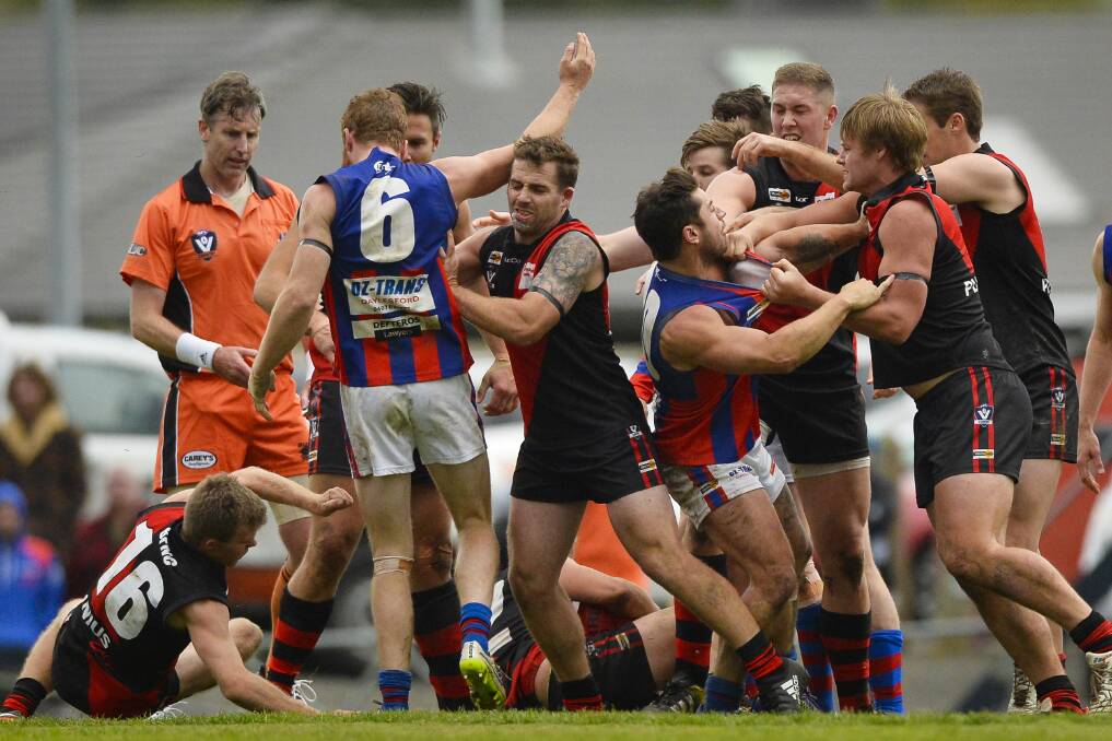 HEATED BATTLE: Players from Buninyong and Hepburn fight during the clash on Saturday afternoon. Picture: Dylan Burns.