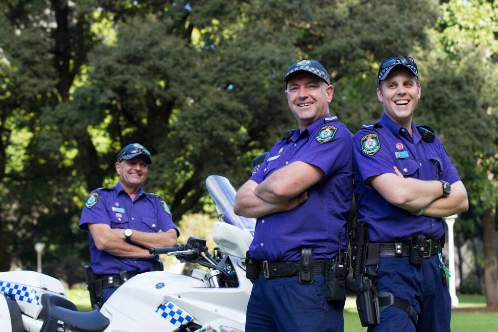 AWARENESS: Leading Senior Constable Craig Parkinson, Senior Constable Andrew Hodgson, and Constable Jarryd De Castro wear purple in Hyde Park, Sydney to celebrate Wear It Purple Day. Photo: Janie Barrett