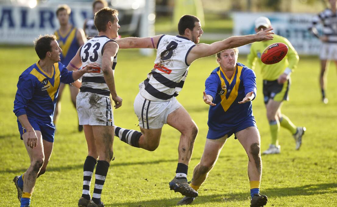GAME ON: Newlyn Cats' Jarrod Fryar competes with Learmonth Lakies' Todd Curran for the ball during the 2018 CHFL seniors Round 9 match in Learmonth. Photo: Dylan Burns