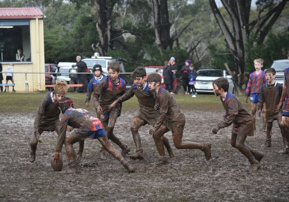 MUDDY: The team gave their all despite the muddy conditions during the tournament. Photo: Kristy Koleski