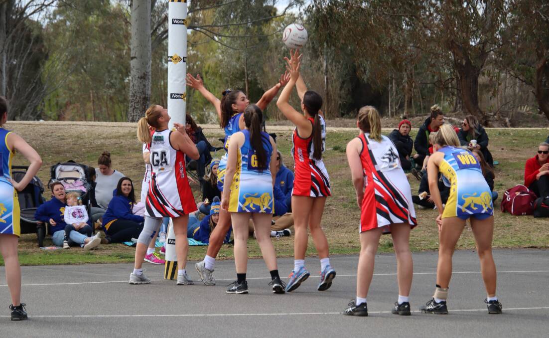 GOAL: Elly Rose shooting the winning goal for the B-grade to advance into the Grand Final. Photo: Liv Bourke