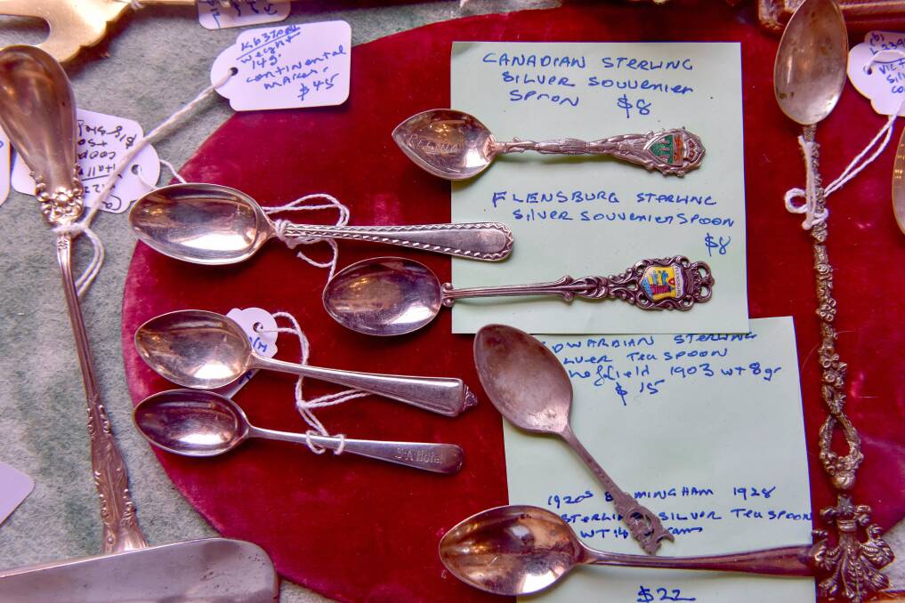 HISTORY: Sterling silver collector's spoons are some of the many interesting items with a history at the antiques store. Photo: Brendan McCarthy