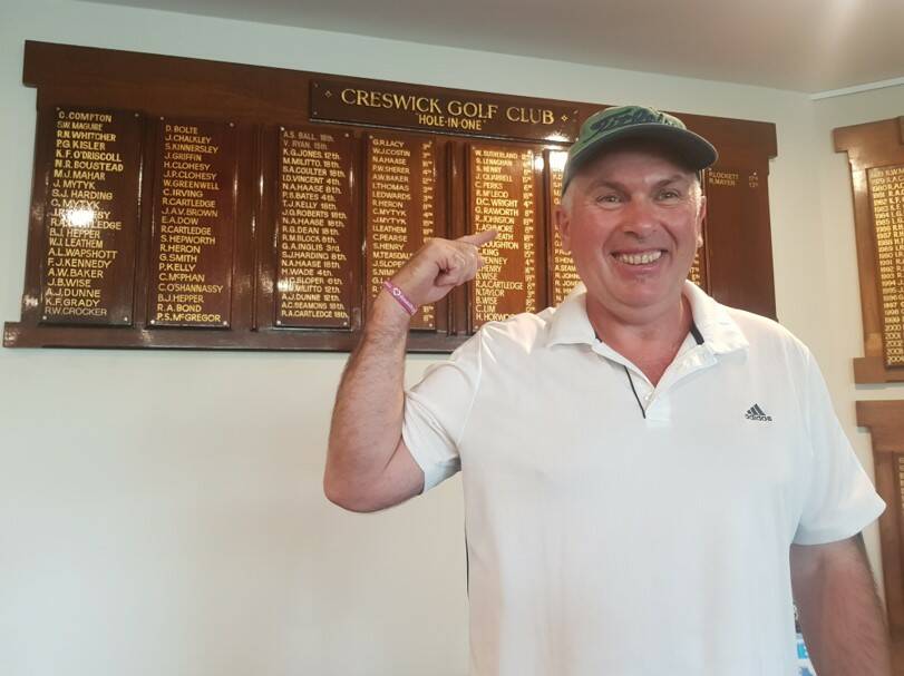 HAPPY: Andrew Seamons celebrating his hole-in-one.