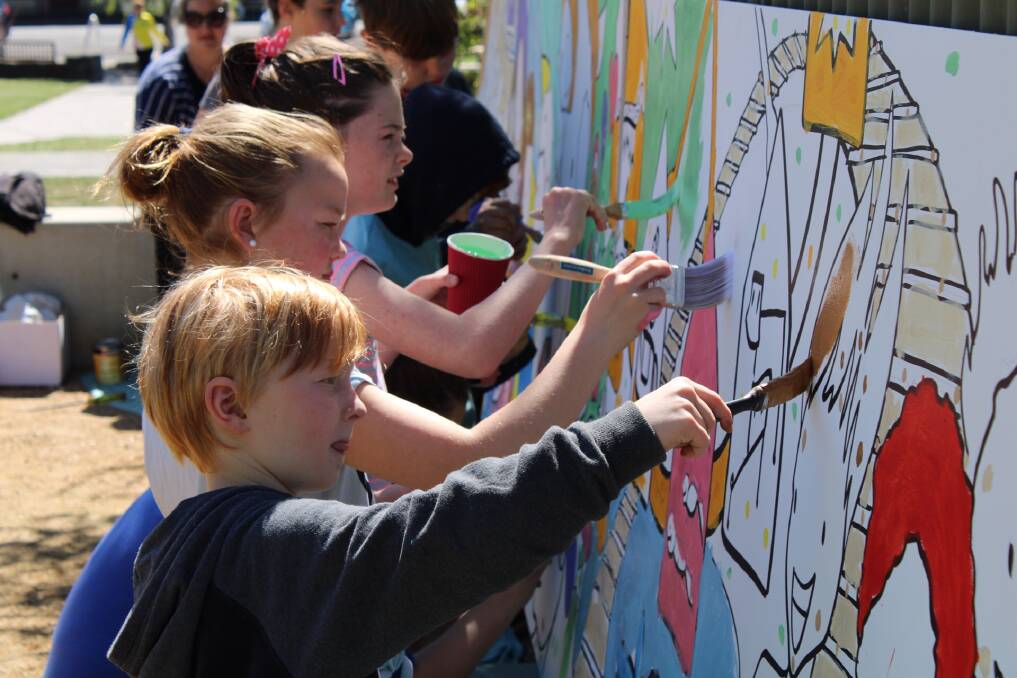 TEAM WORK: Nine-year-old Ryan, ten-year-old Olivia and nine-year-old Grace all worked together to paint the mural. Photo: Hayley Elg