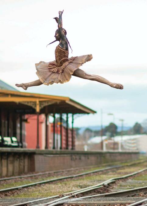 MAGNIFICENT: Ballerina Elise Melotte jumps over the train tracks in Daylesford. Photo: Sean McDonald