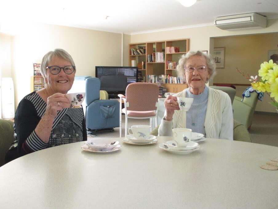 HIGH TEA: Volunteer Kath Morrison with Trentham Aged Care resident Hilary Reid.
