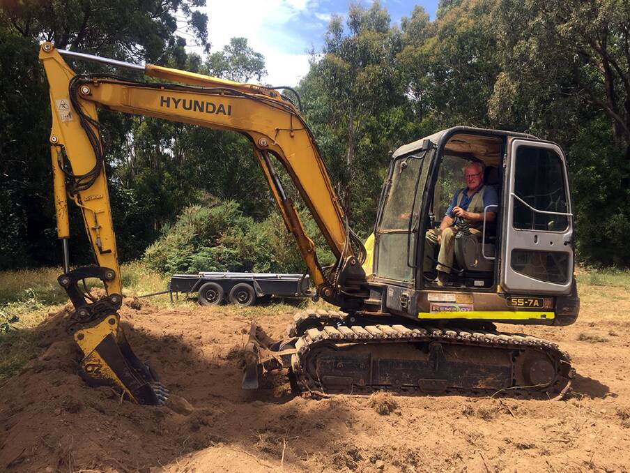 PREPARING: Stan Falloon on the excavator, preparing the site on which the Trentham Men's Shed will sit.
