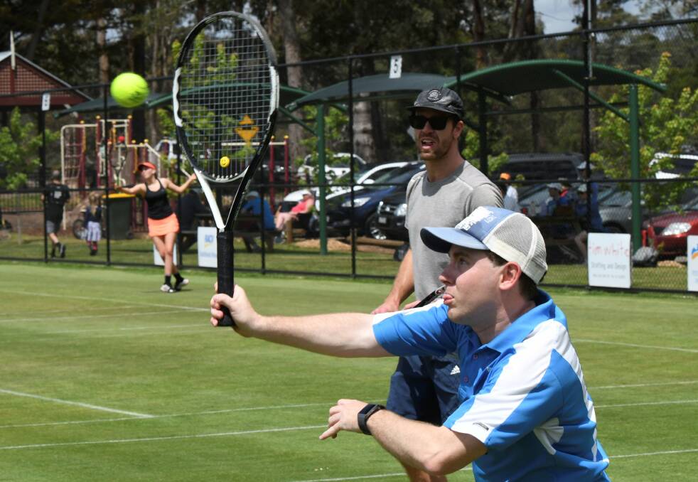HIT: Smeaton's doubles champions Adam Sewell and James Mahar during their winning set against the Ballarat Berties at the weekend. Photo: Lachlan Bence