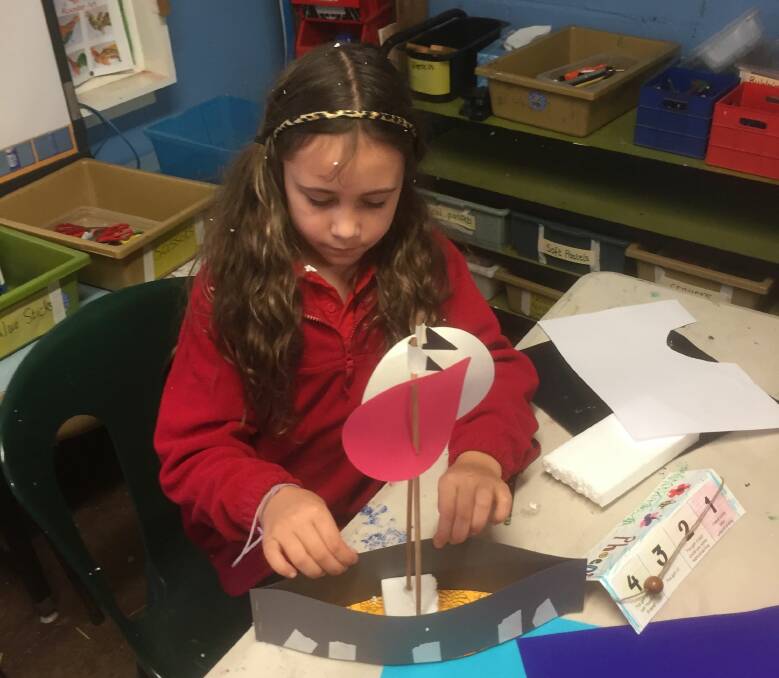 WOW: Mia Sceri building a boat during Hepburn Primary School's celebration of the arts for Education Week.