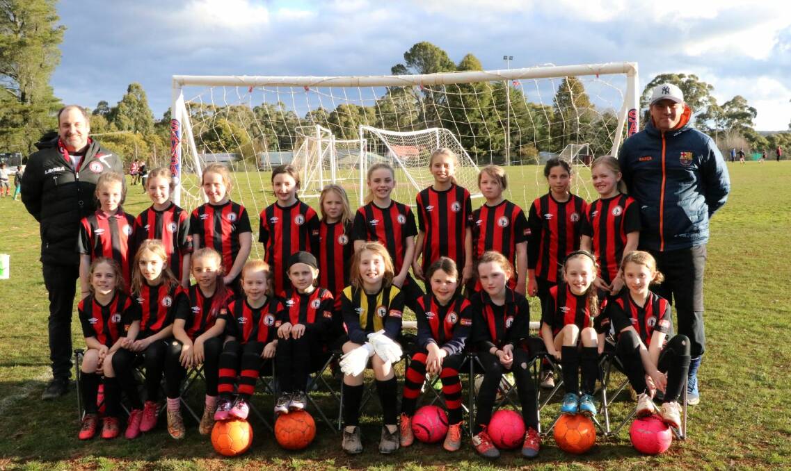 FIRE BLAZERS: The Daylesford and Hepburn United's Miniroos girls have had a stellar season, displaying teamwork, courage and passion. Photo: Supplied