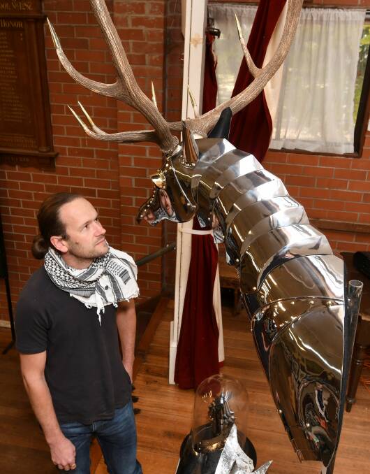 IMPRESSIVE: Sculpture artist Sam Bloomfield with his award-winning stag's head at the Trentham Easter Art and Craft Show. Photo: Lachlan Bence