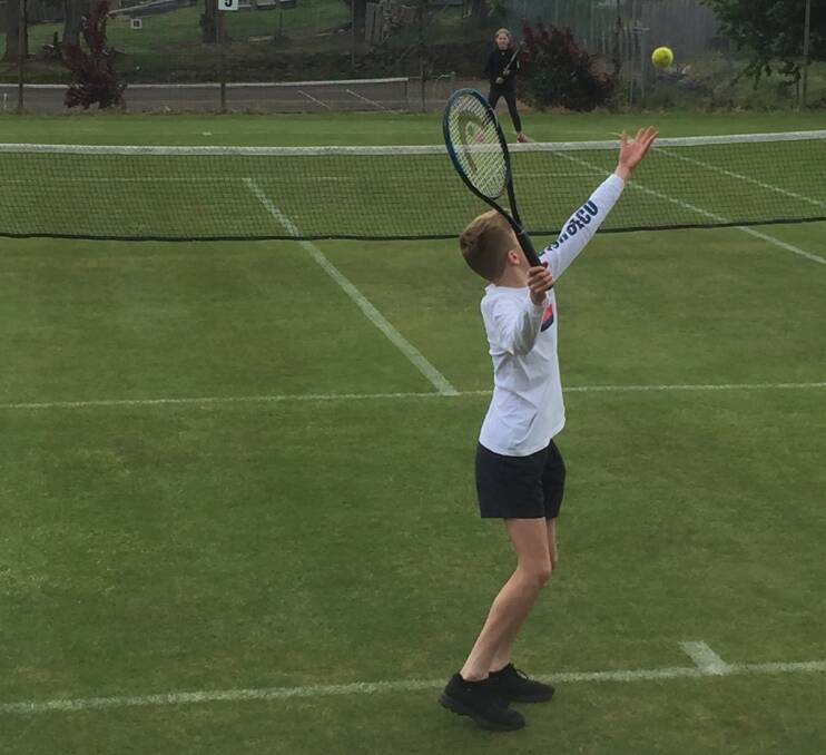 SERVE: Adam Leonard serving in section two of the junior tennis competition at Daylesford Lawn Tennis Club. 