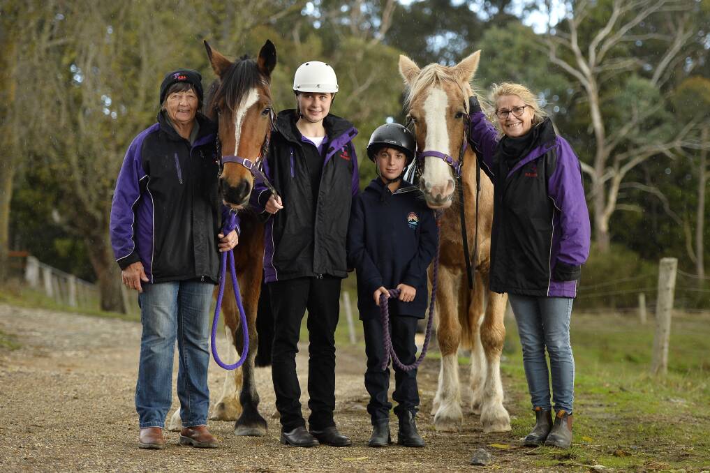 HAPPY: Wendy Hogben, Arielle Thibaut, 15, Liam Crowne, 9, and Sal Armstrong with horses Jordan (left) and Bailey (right) at Boomerang Ranch. Photo: Dylan Burns