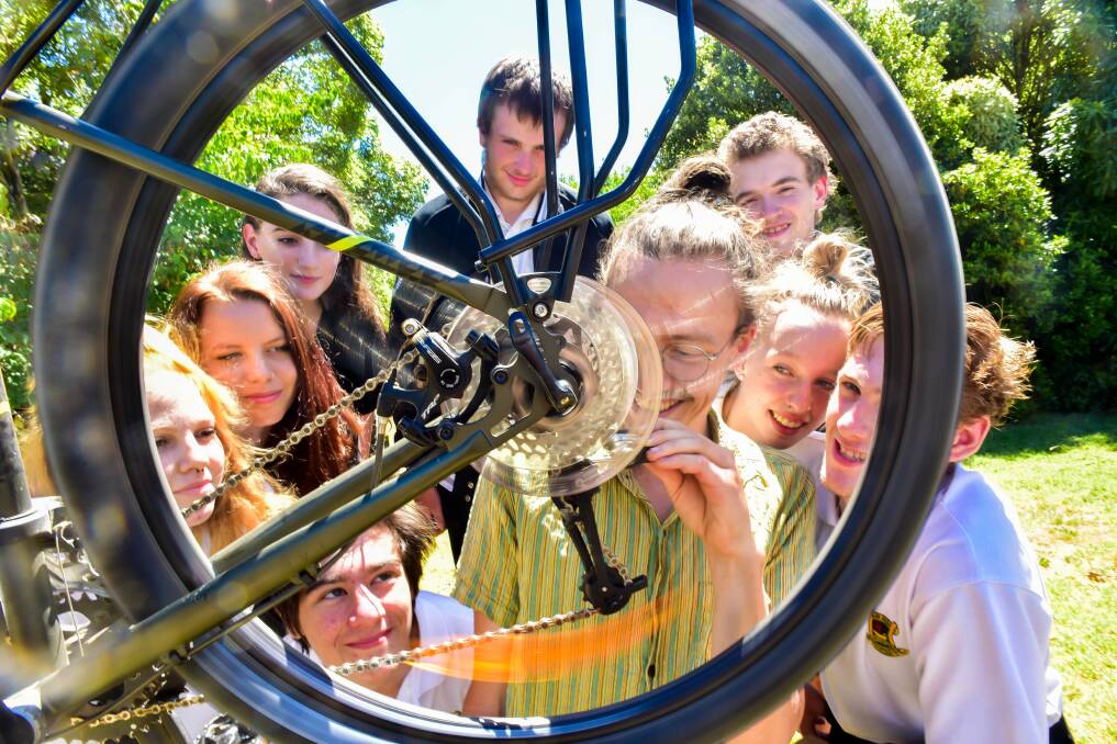 SKILL SHARING: Bicycle fixer Finn Ryan with Daylesford College students Josh Barry, Sophie Jones, Alkira Cox, Katie Dwyer, Aaron Orr, Adam Hartup, Alicia Ray and Nathan Sutton. Photo: Brendan McCarthy
