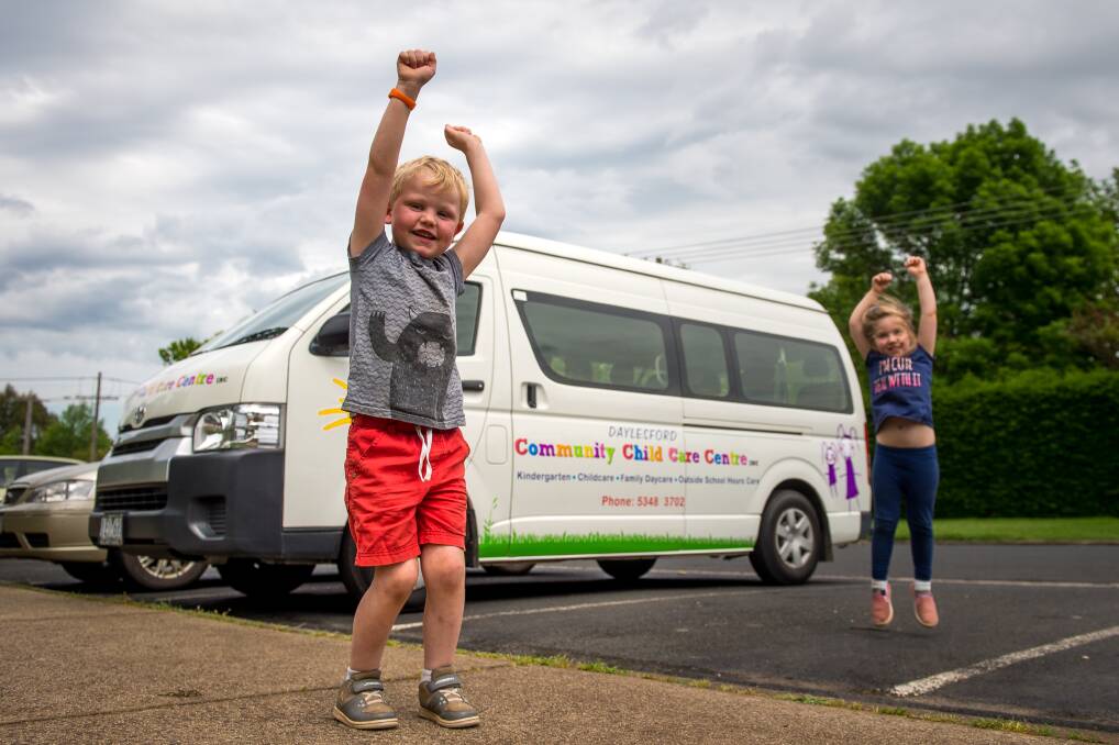 YIPEE: Four-year-old children from Daylesford Community Child Care Centre, Mason and Celine, with the bus they designed. They look forward to going out on more excursions. Photo: Dylan Burns