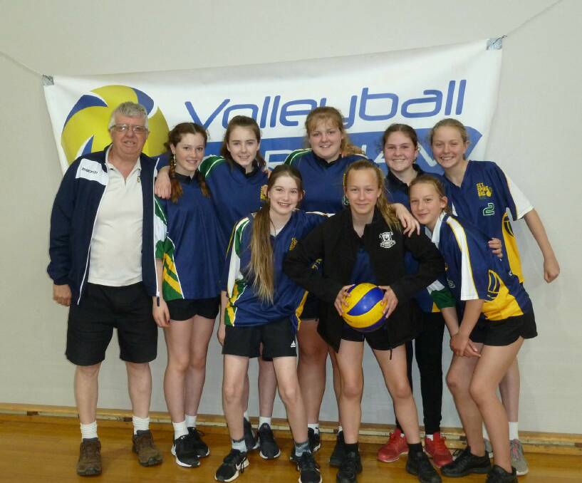 SMILES: Coach Colin Priest with Sienna Milton, Lauren O’Brien, Sophie Elderfield, Ruby Hunt, Eve Britten (back) and Asha Loft, Kira Vandenberg and Jess Vandenberg (front) are preparing for the state volleyball championships.