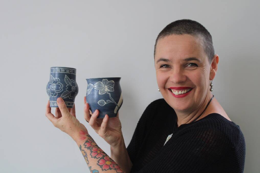 HANDMADE: Belinda Michael of Felix Ceramics with two of her vases, made with the sgraffito technique. Photo: Hayley Elg