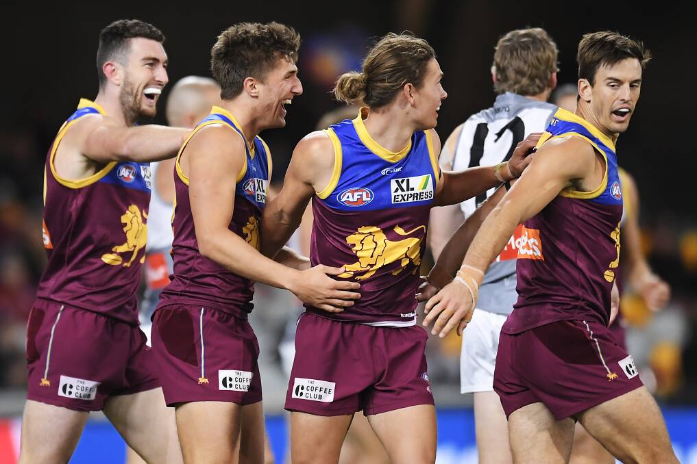 Zac Bailey of the Lions celebrates with teammates after scoring a goal during the Round 5 AFL match against Port Adelaide at The Gabba last Saturday. Photo: Albert Perez/Getty Images
