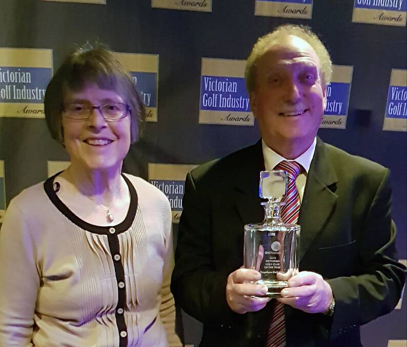 TOP HONOUR: Trentham Golf Club committee member Anne Cooper and president Keith Webster accept the Victorian Club of the Year Award. Picture: SUPPLIED
