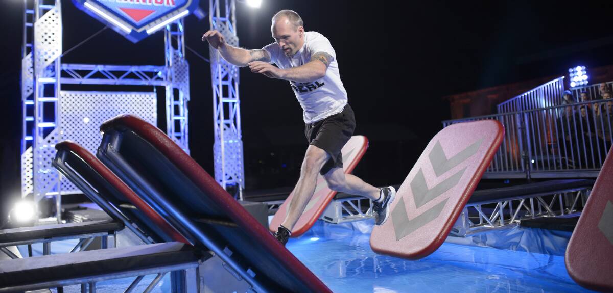 CLUNES NINJA: Neal Holmes tackles the iconic quintuple steps, the first obstacle on the challenging Australian Ninja Warrior course.