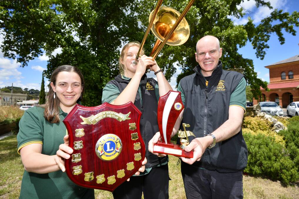 LOUD WIN: Creswick Brass Band musical director Katrina Bird, band member May Thomas and band secretary Roger Clark celebrate the Creswick Brass Band wins at the Mt Gambier Band Festival. Picture: Dylan Burns