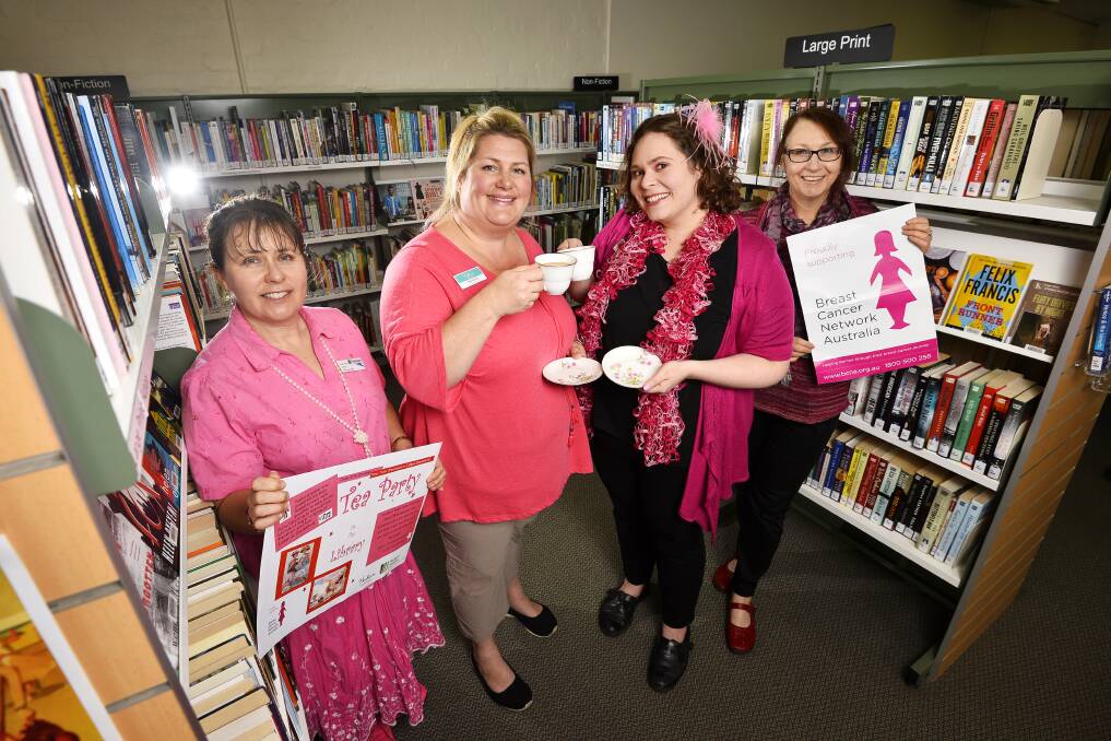PINK TEA PARTY: Hepburn libraries staff Elizabeth Wells, Meg Klavins, Erin Rule and Katrina McLachlan prepare for a pink tea party for breast cancer at the Daylesford and Trentham library on Friday. Picture: Dylan Burns