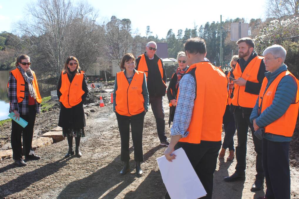 Hepburn Shire Council project manager Richard Howell speaking to Macedon MP Mary-Anne Thomas, Hepburn Shire Council mayor Sebastian Klein and others at Lake Daylesford on Friday. Picture: Rochelle Kirkham. 
