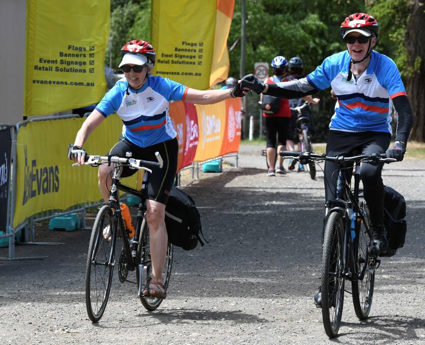 BIG RIDE: Greg Lyons and Sara Lyons finish Ride Daylesford on Saturday. Pictures: Lachlan Bence