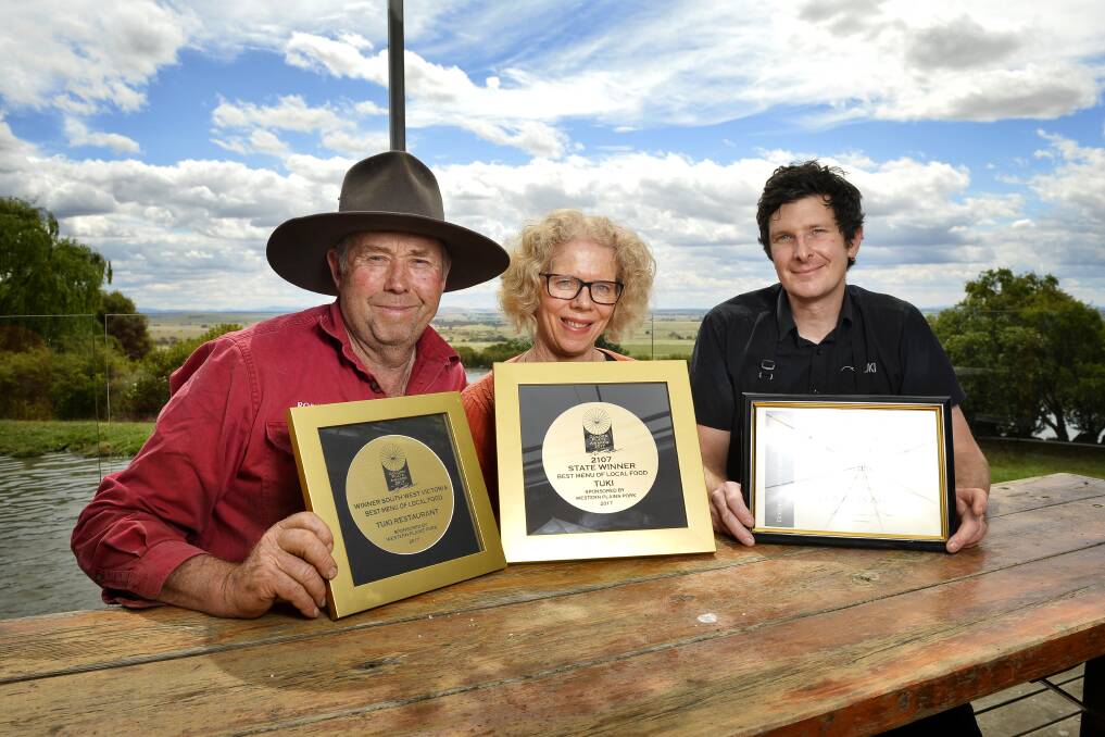 LOCAL FOOD: Tuki Farm owners Robert Jones and Jan Jones celebrate their Golden Plate Award for best menu of local food with restaurant chef Benjamin O'Brien. Most food served is sourced from their own farm. Picture: Dylan Burns 