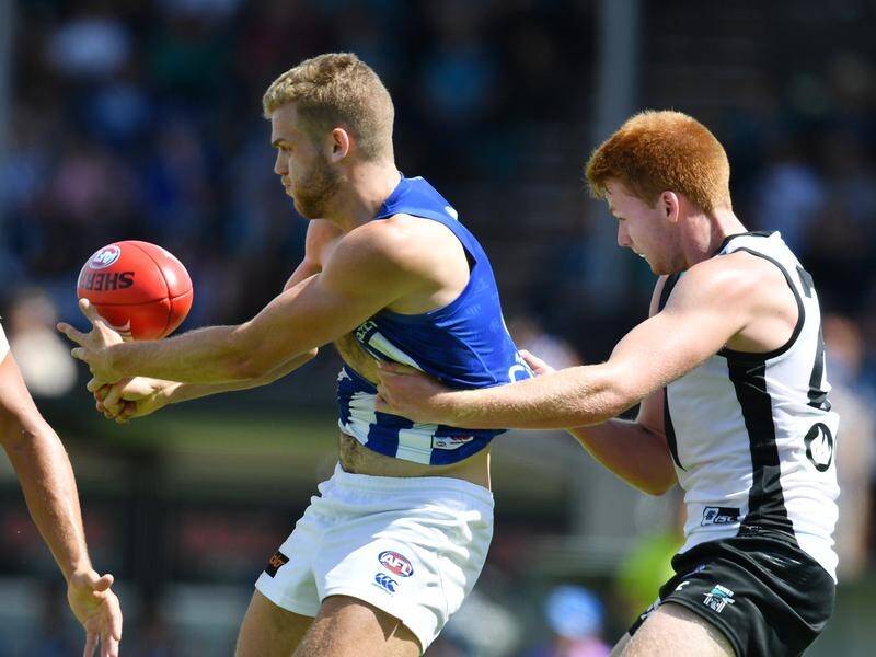 Ed Vickers-Willis' (L) AFL season is over after being hurt in North Melbourne's opening-round loss.